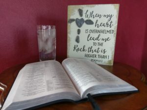 An open Bible on a wooden table